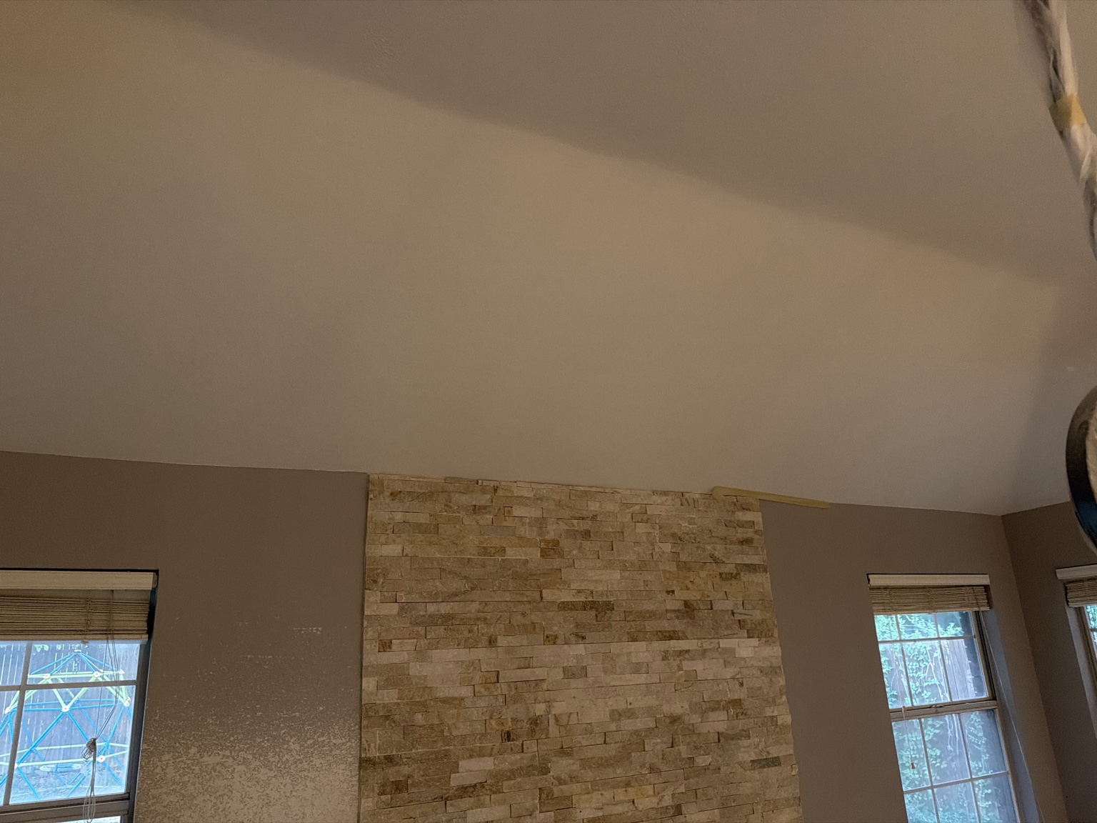 Ceiling above fireplace showing slope out into room